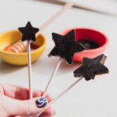 Three star shaped elderberry lollipops.