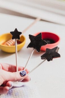 Three star shaped elderberry lollipops.