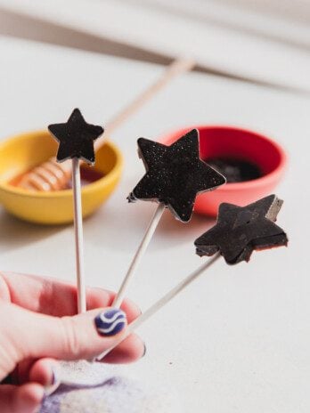 Three star shaped elderberry lollipops.