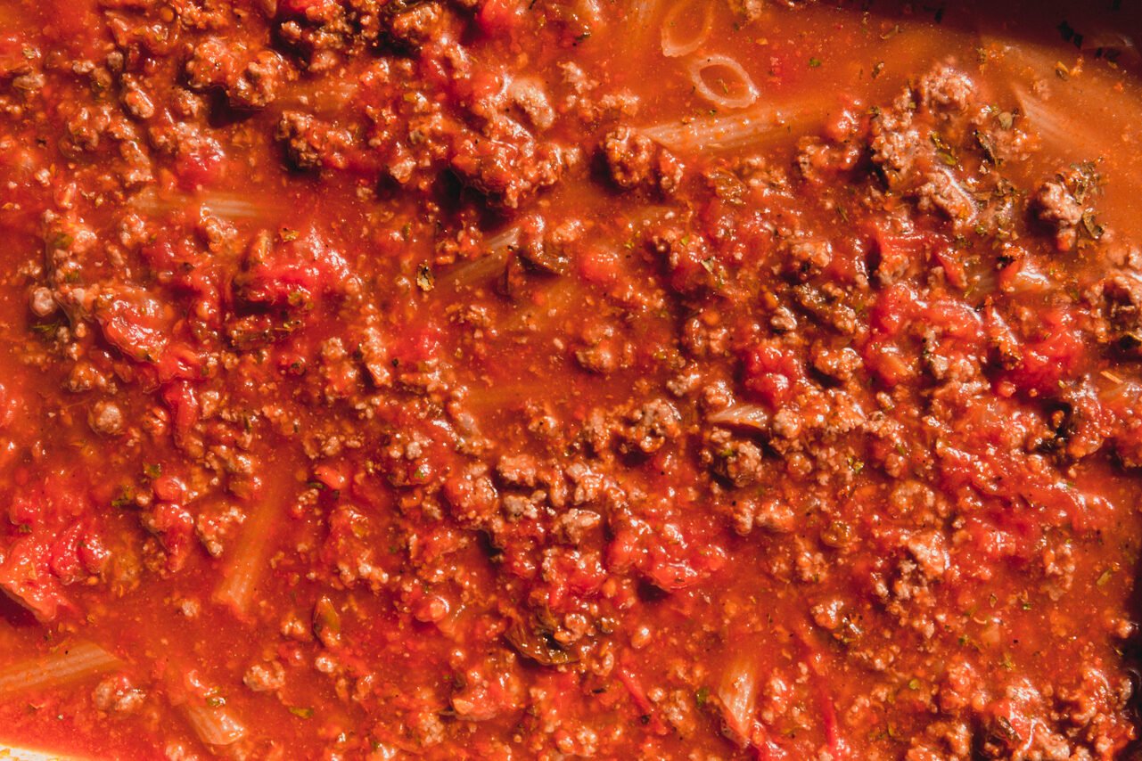 No boil pasta bake ingredients stirred.