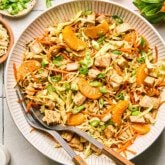 Chinese chicken salad on a plate with silverware.