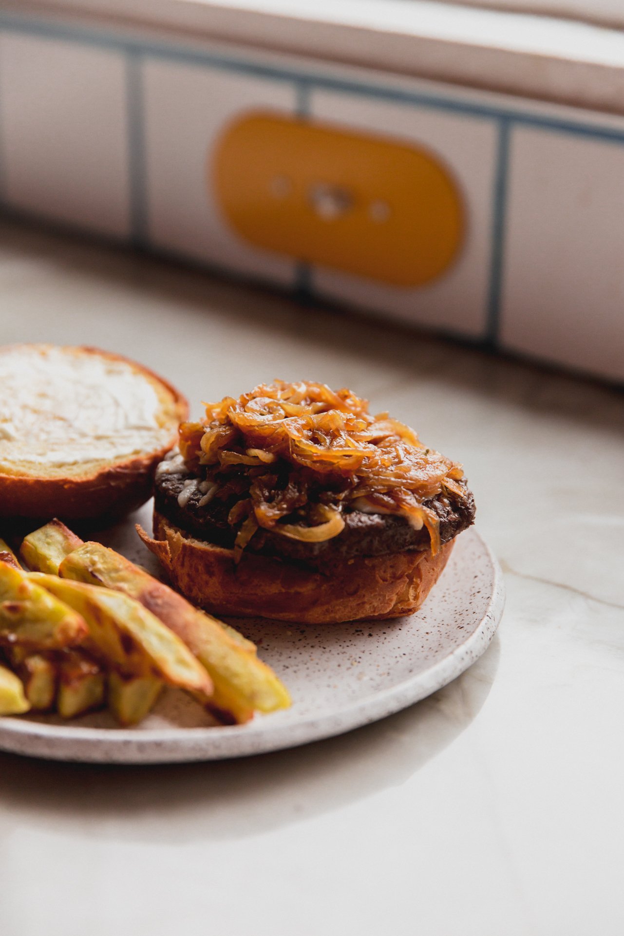 French onion burger served with fries. 