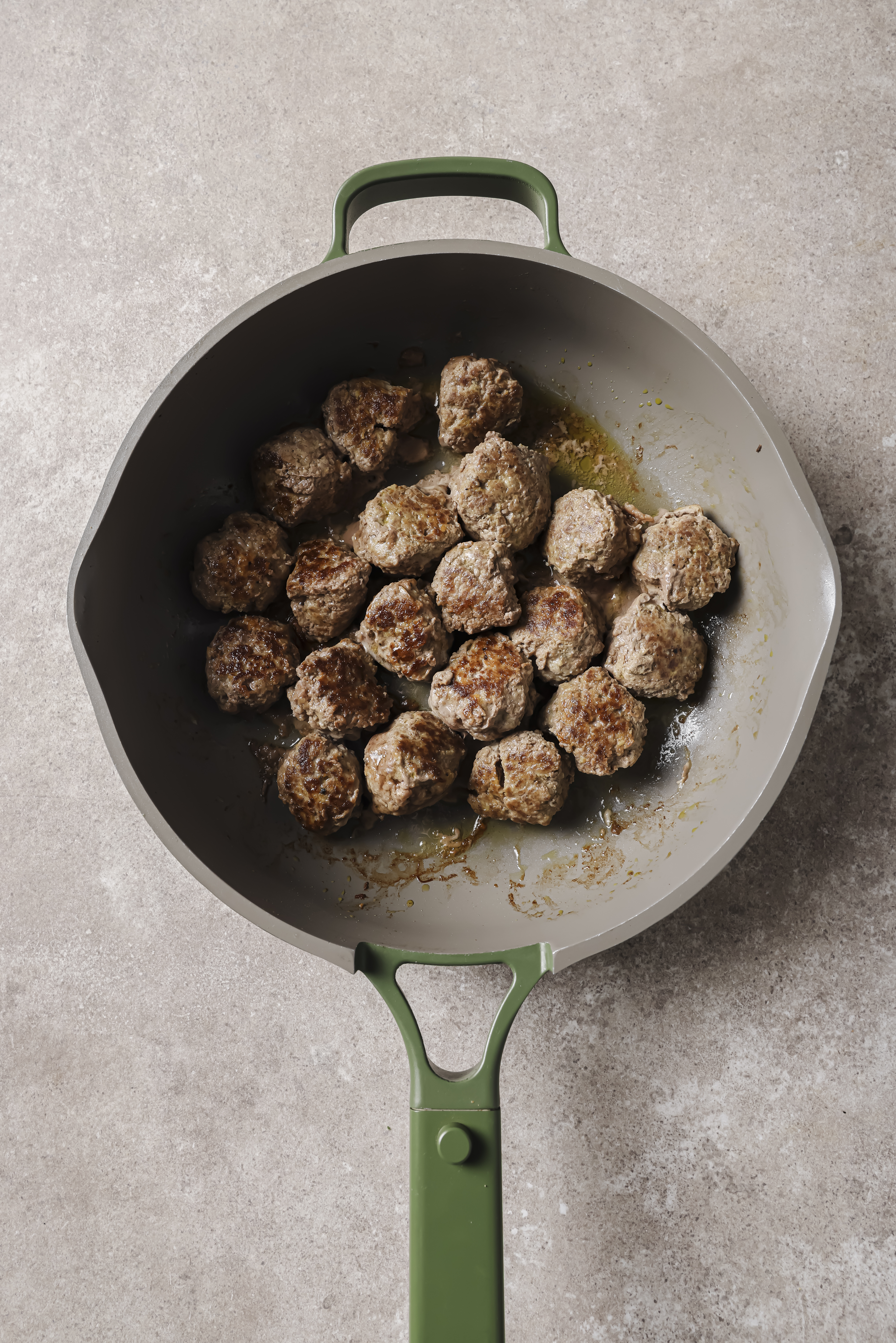 meatballs cooking in a pan