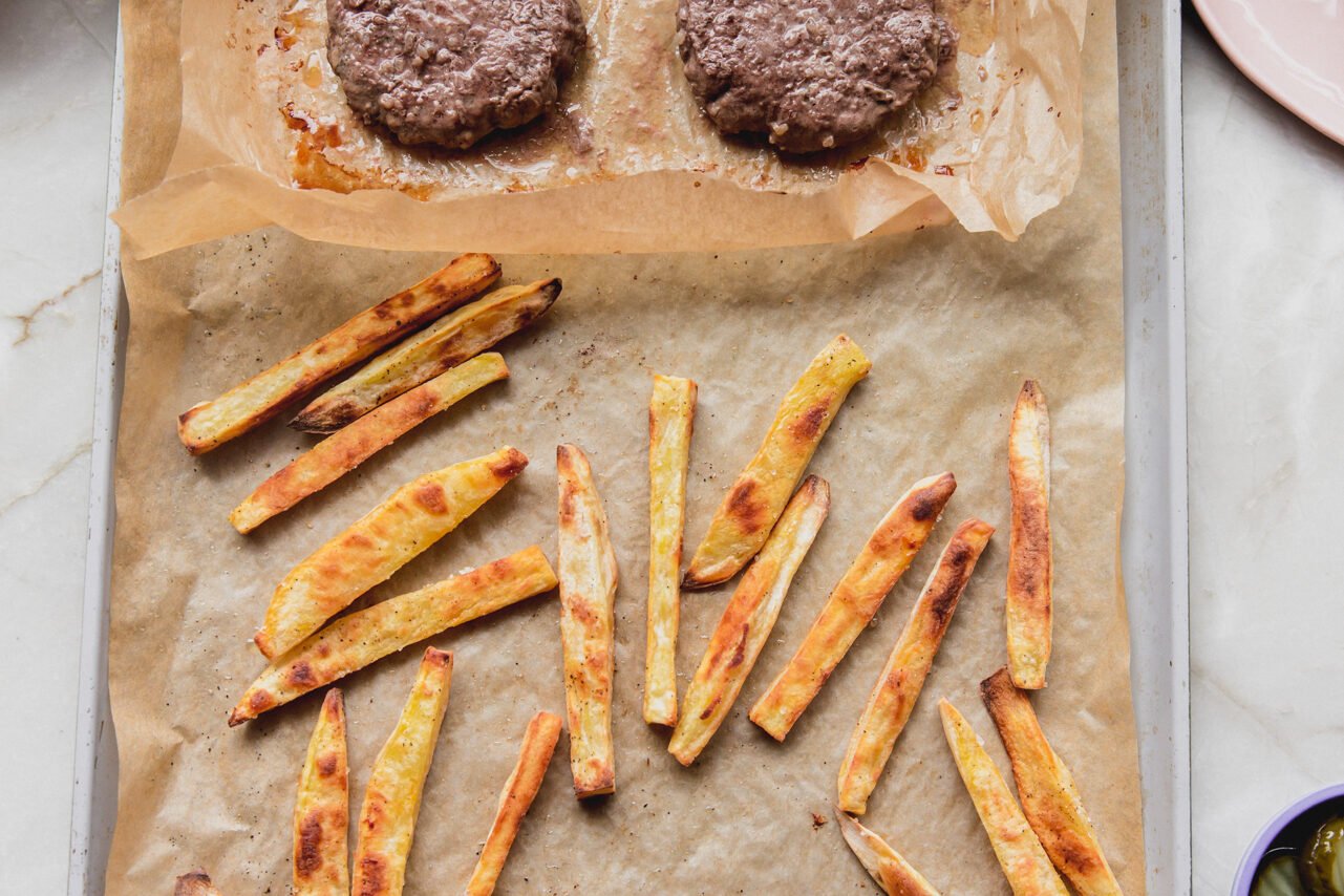 The sheet pan burgers and fries after cooking, ready to be enjoyed.