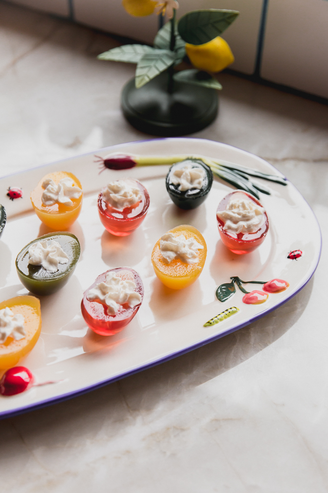 Jello deviled eggs on a large platter.