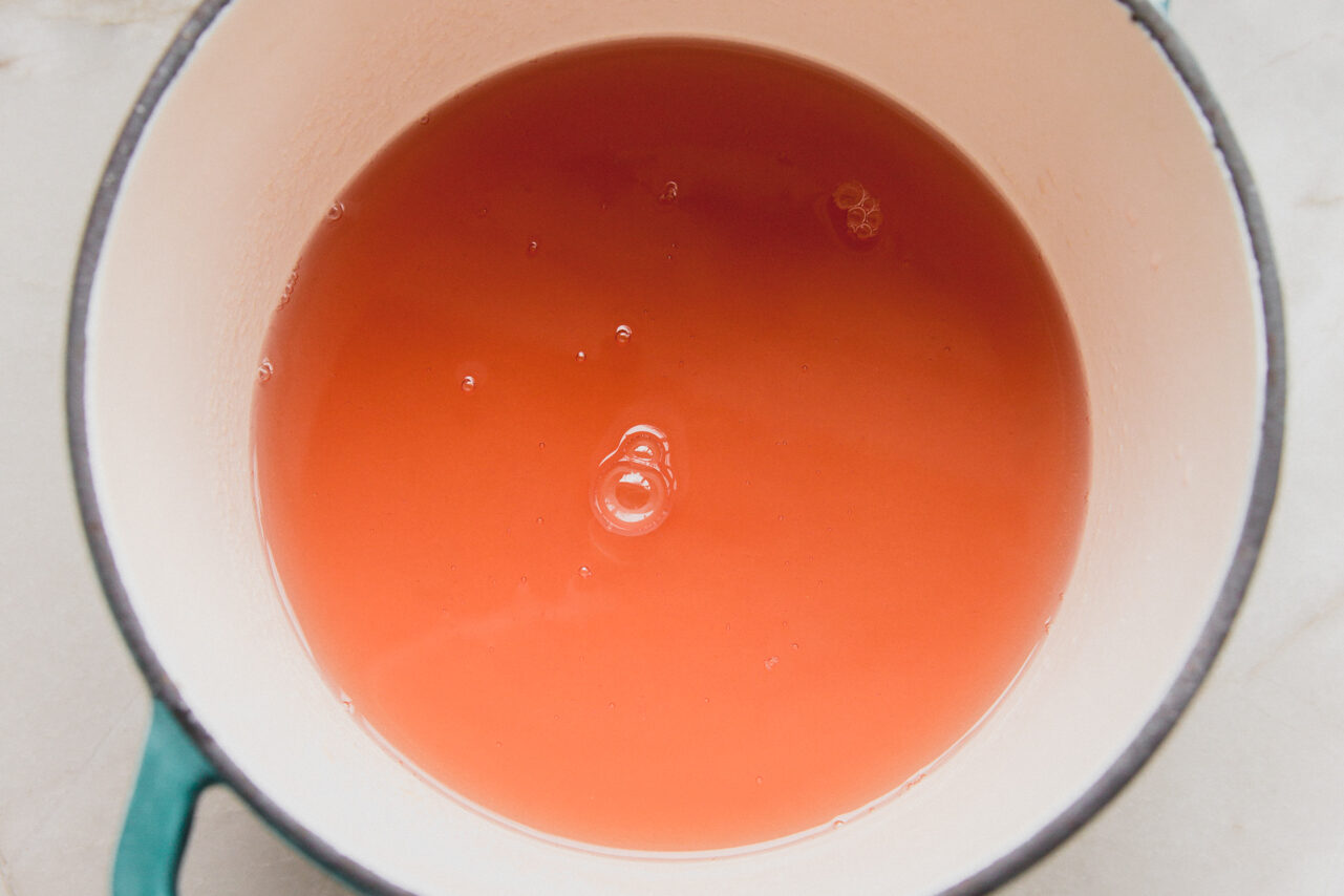The fruit juice mixture after heating and stirring.