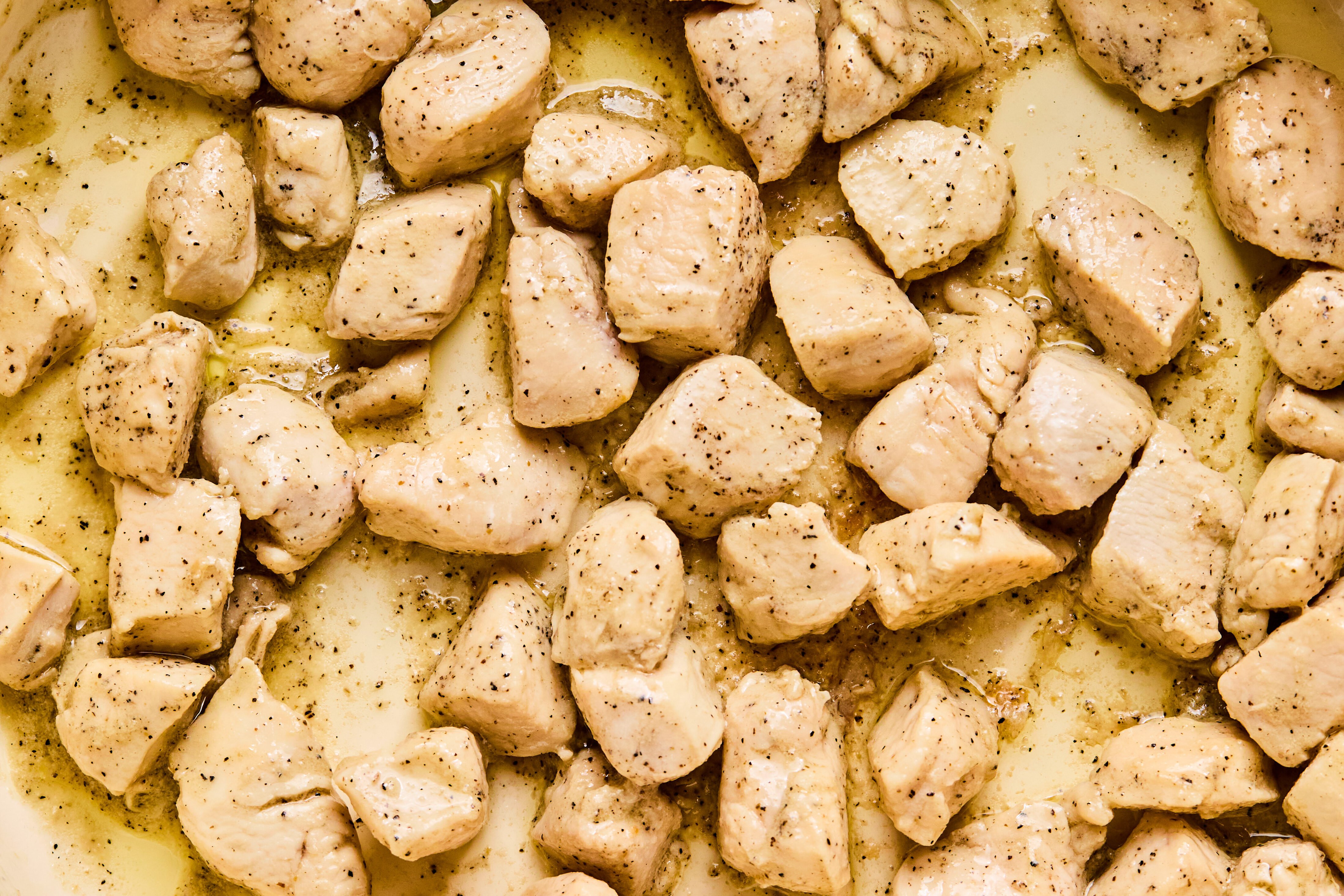 Cubed chicken in a pan. 