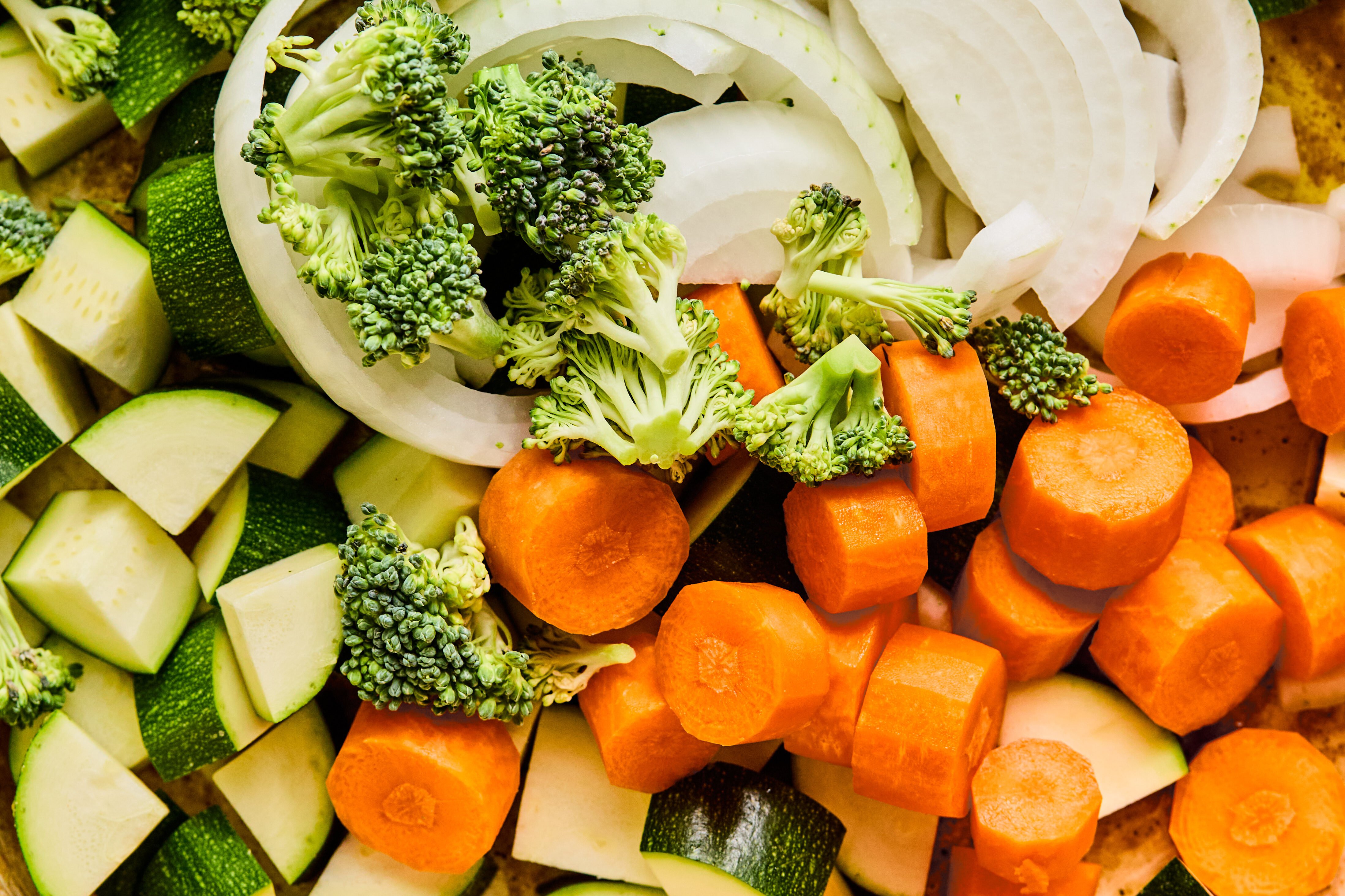 Hibachi chicken vegetables uncooked in a pan.