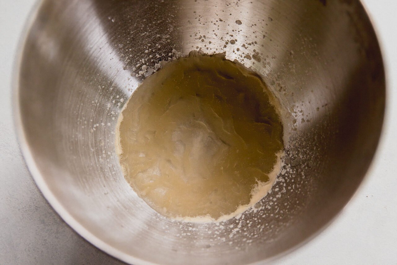 Gelatin and water in a stand mixer.