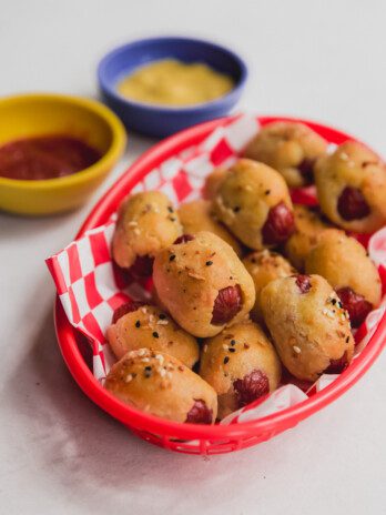 Gluten free pigs in a blanket in a basket.
