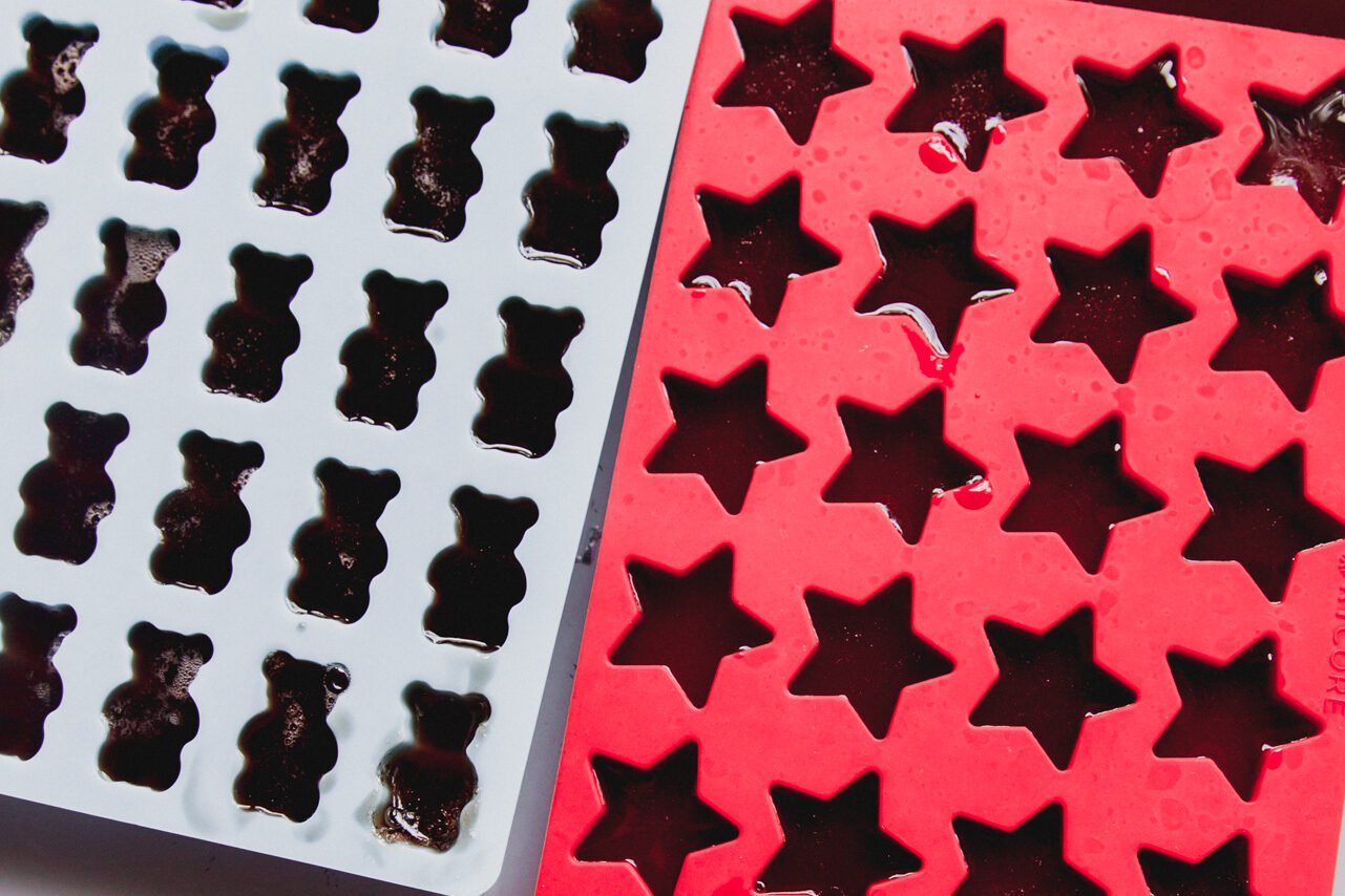 Cherry gummies set in a mold. 