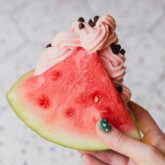 Watermelon dole whip inside a watermelon wedge.