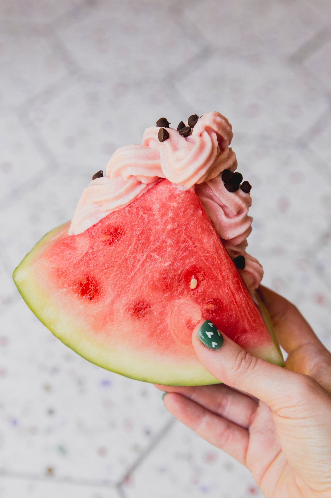 Watermelon dole whip inside a watermelon wedge.