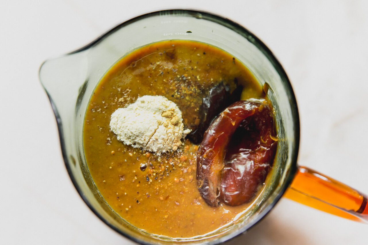 BBQ sauce ingredients in a measuring cup, unblended. 