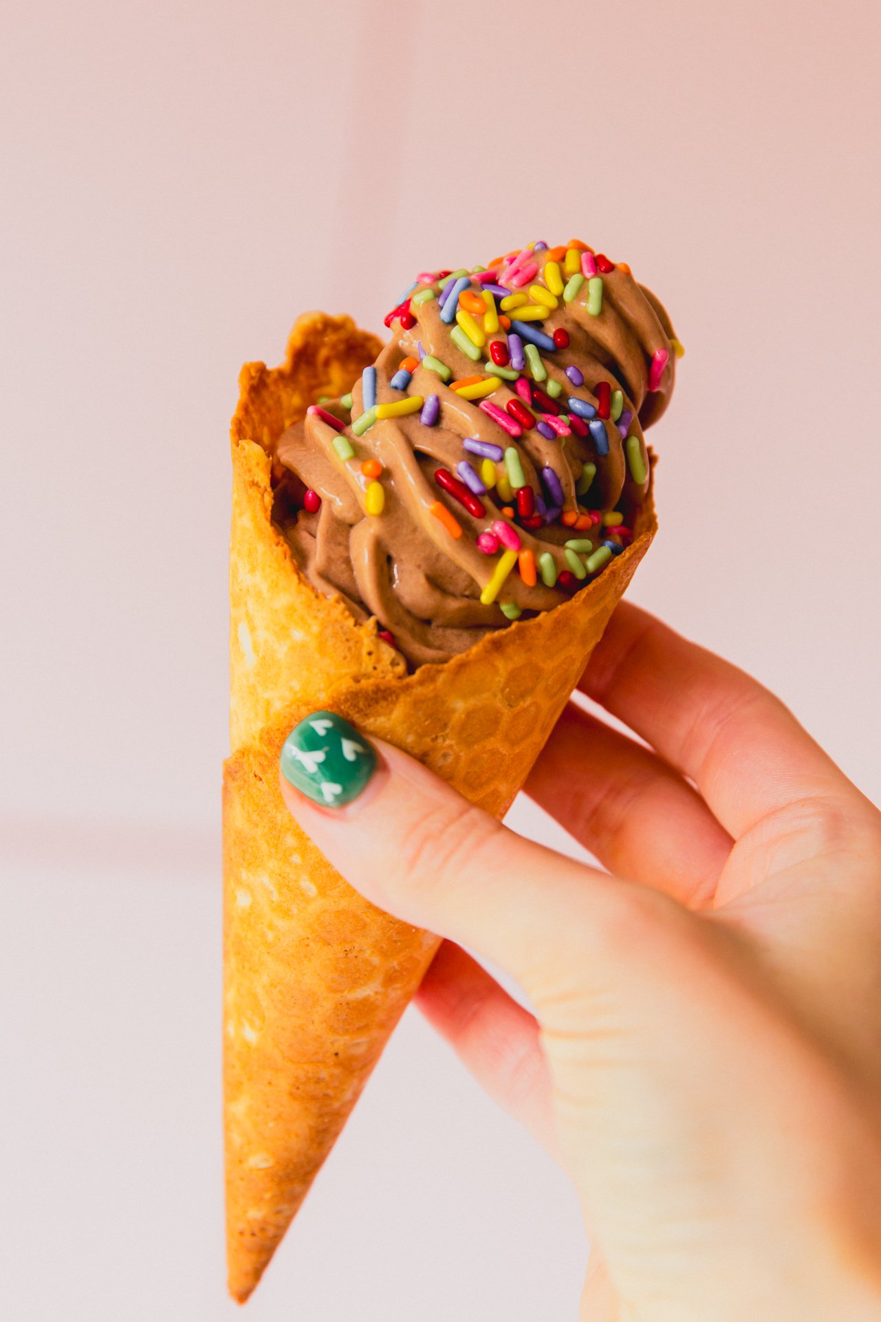 Chocolate protein ice cream in a cone.