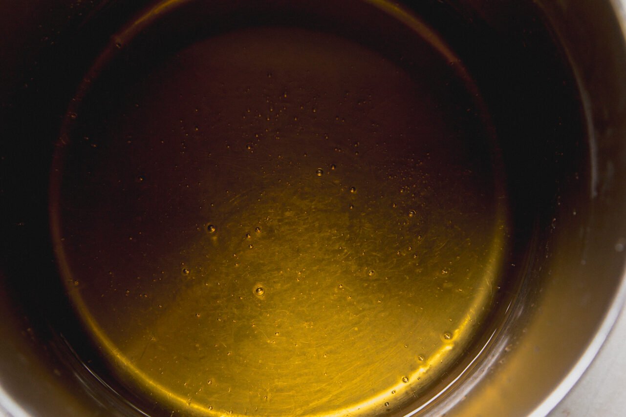 A pot with honey and water before heating. 