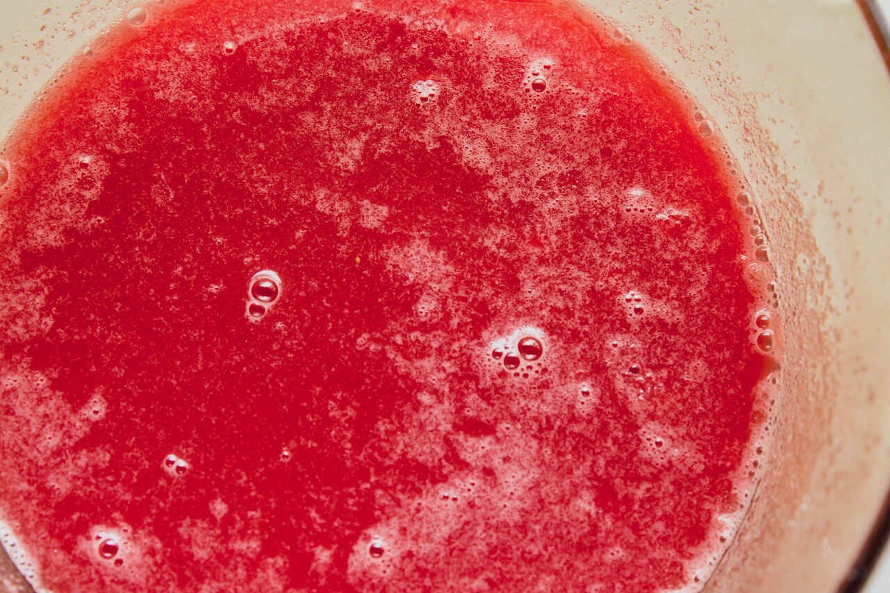 Watermelon gummy liquid in a pot.