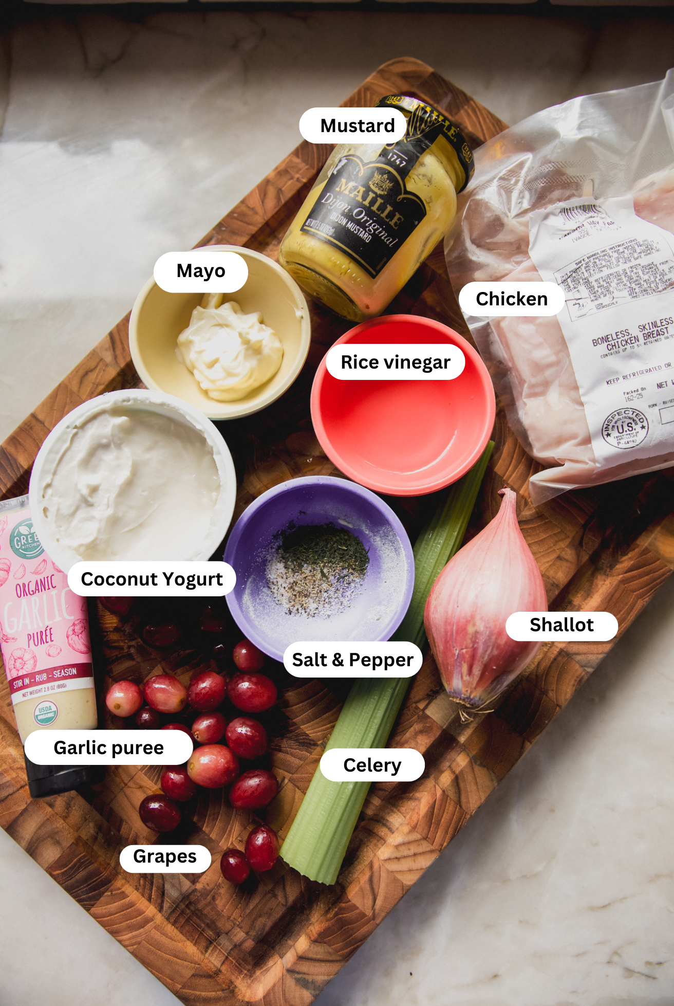 All the ingredients needed to make chicken salad with grapes.