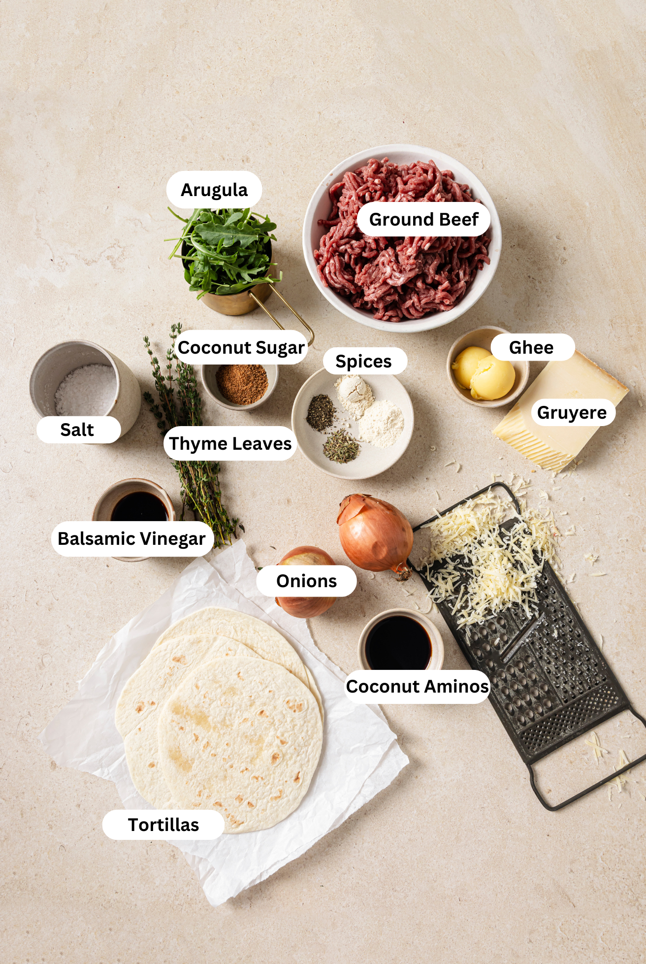 All of the ingredients to make French onion smashburger tacos laid out.