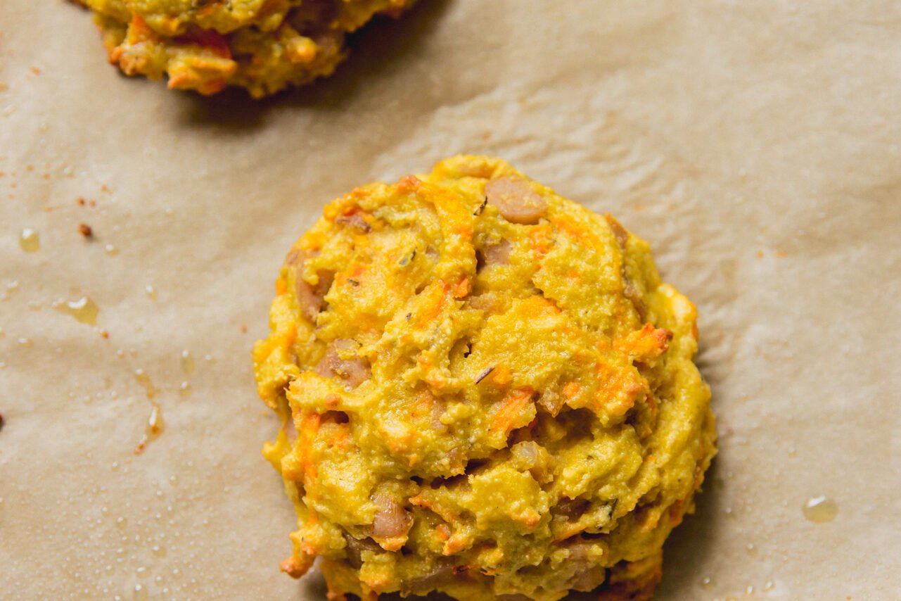 A cooked protein breakfast biscuit on a baking sheet.