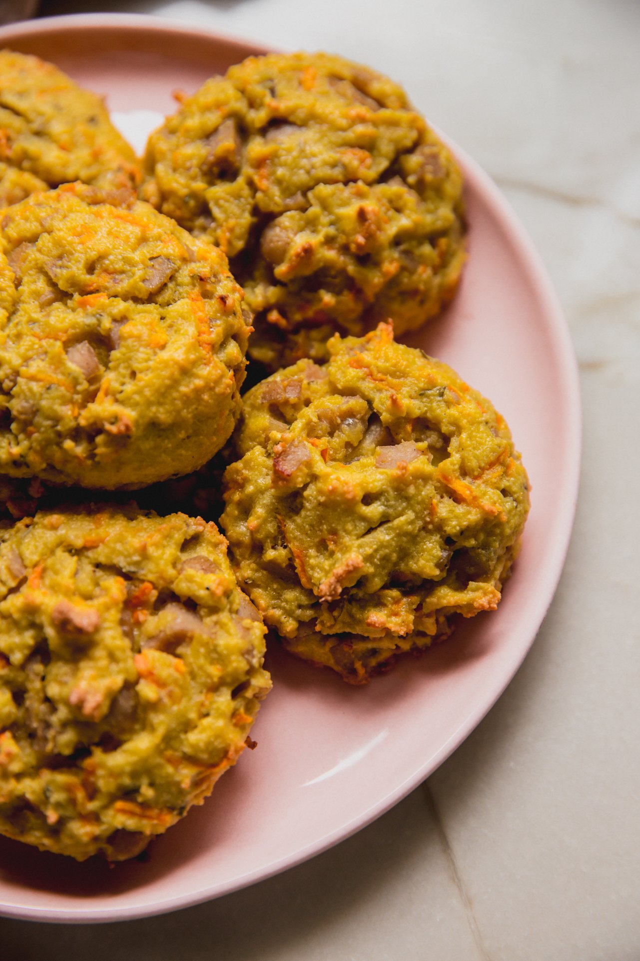 Protein breakfast biscuits on a pink plate. 
