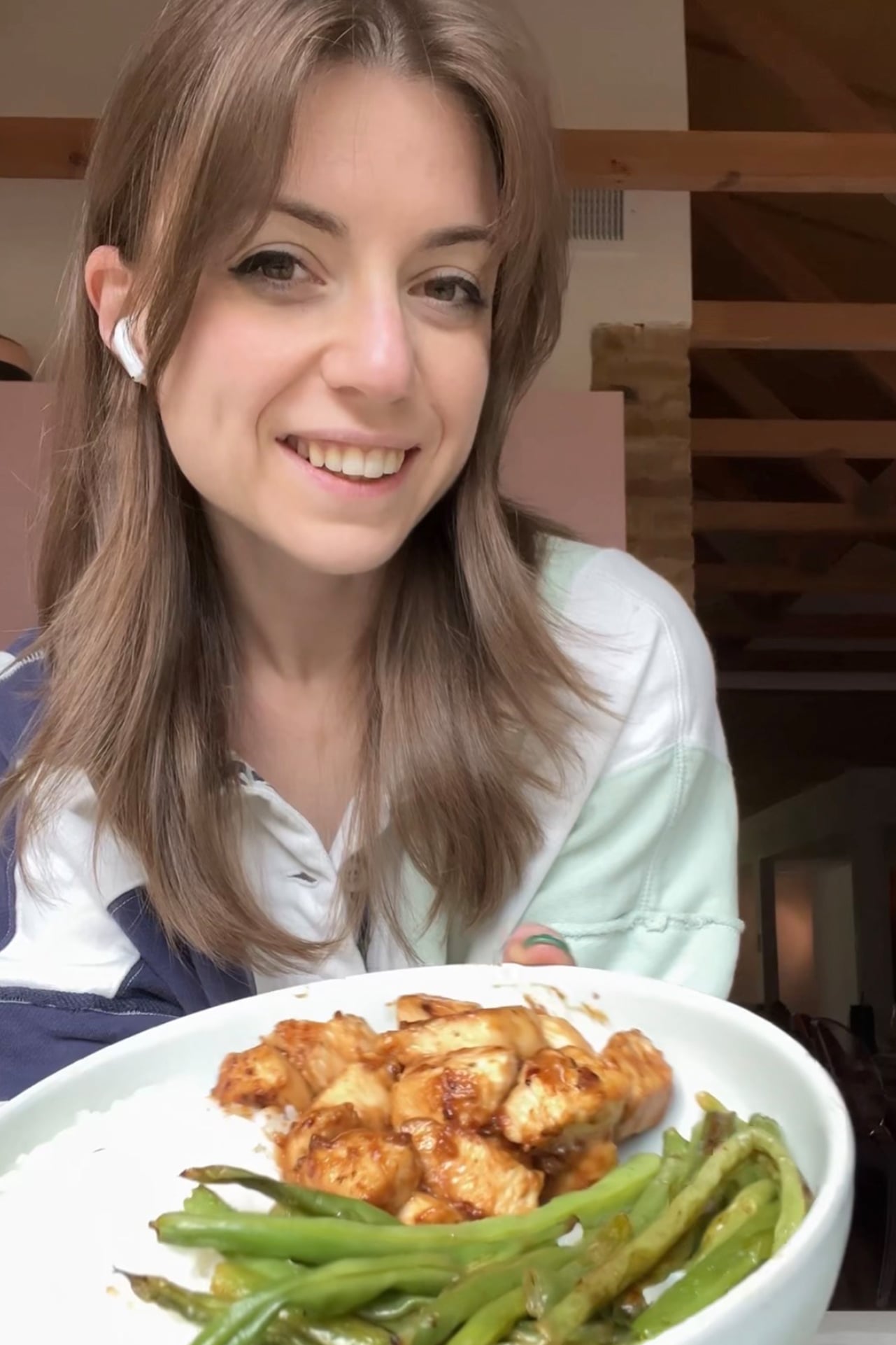 Food blogger Michelle Hoover holding a honey mustard chicken bowl