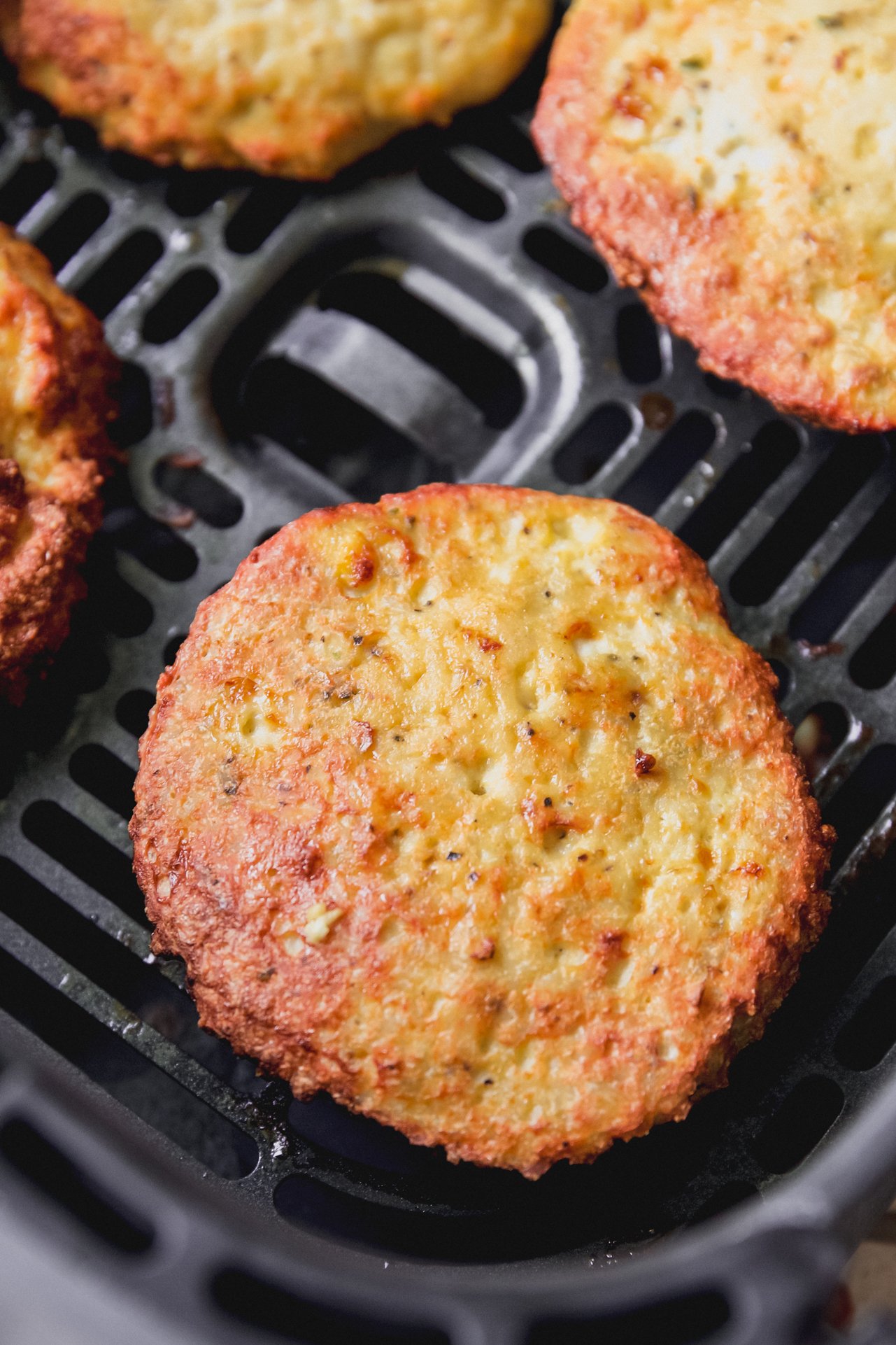 Air fryer chicken patties fully cooked in the air fryer. 