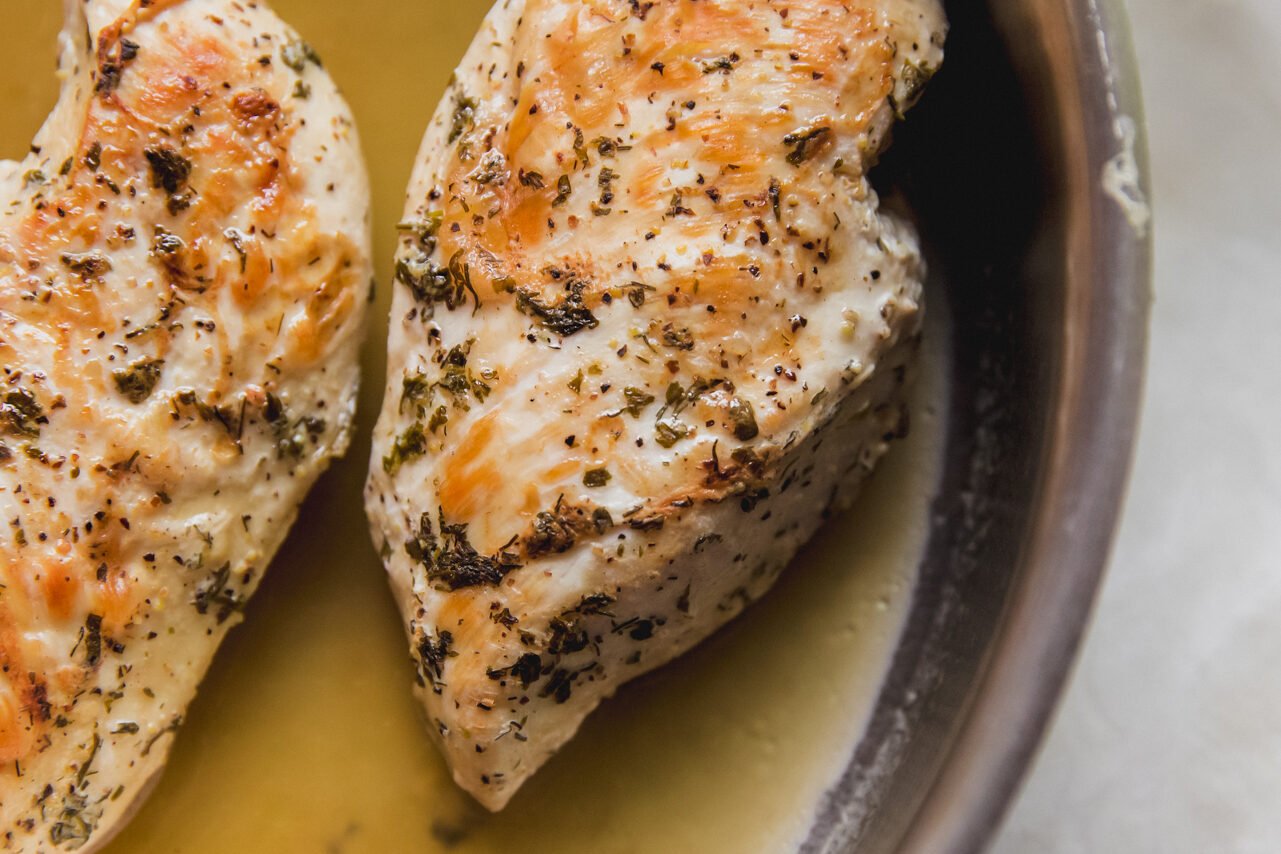 The chicken breasts cooking before shredding.