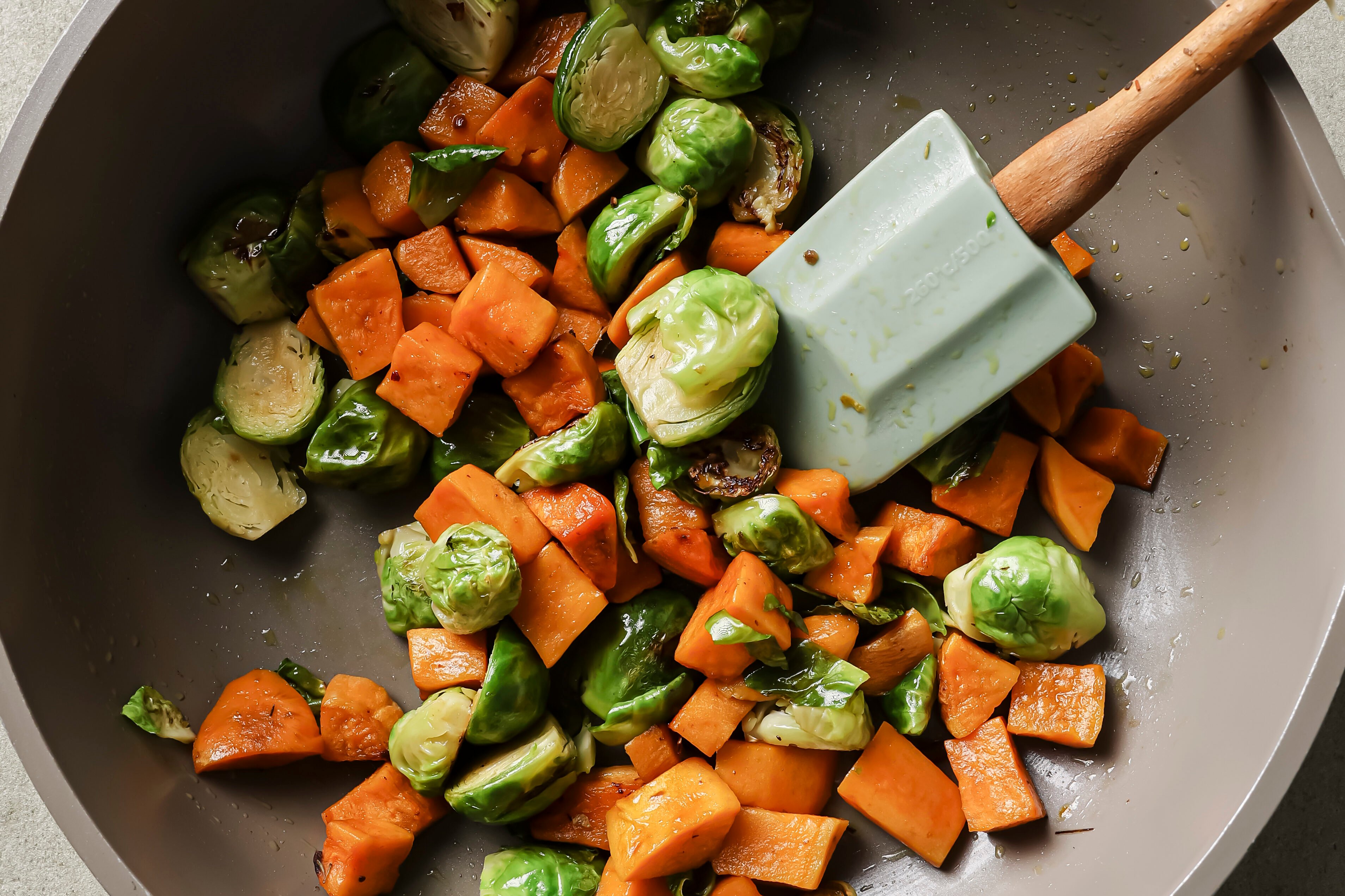 Vegetables sauting in a pan.