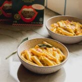 Butternut squash pasta in separate bowls.