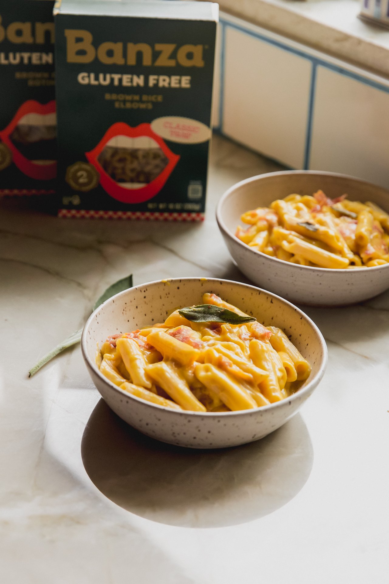 Butternut squash pasta in separate bowls.