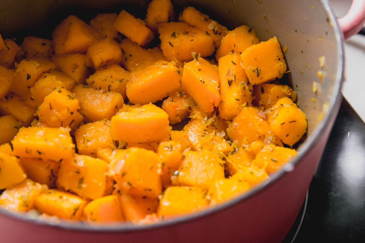 Butternut squash cooking in a dutch oven.