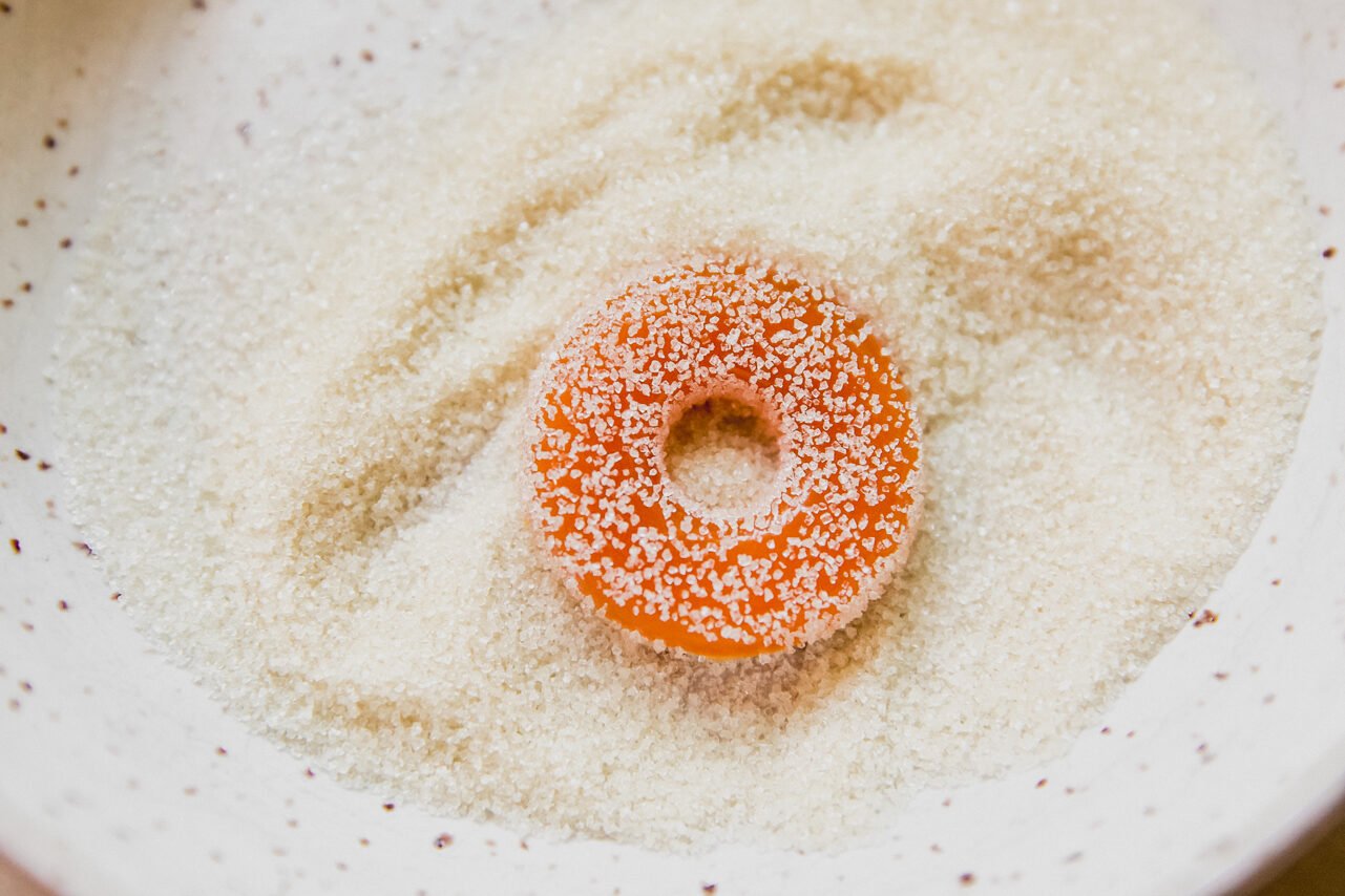 Protein peach rings tossed in sugar.