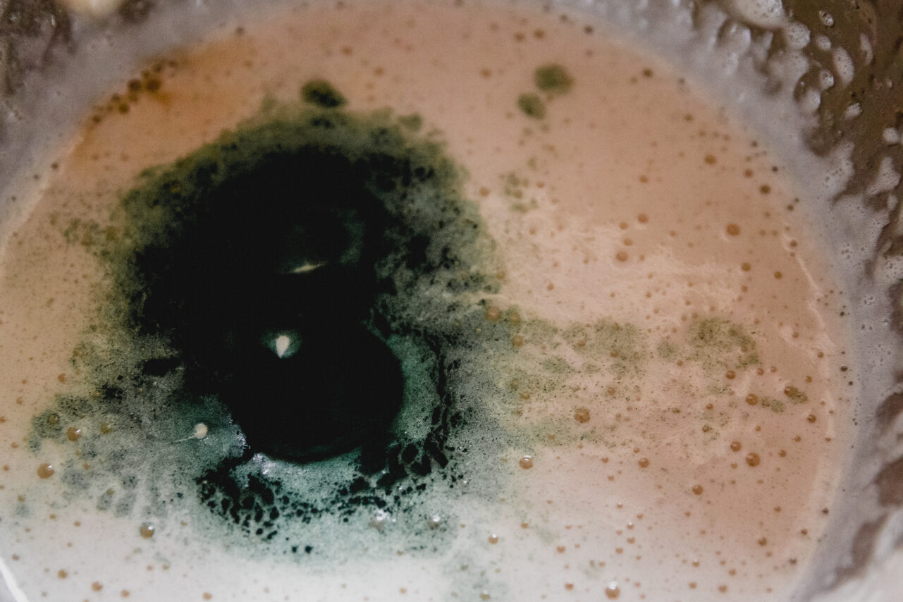 The mixture to make the green layer in the metal bowl.