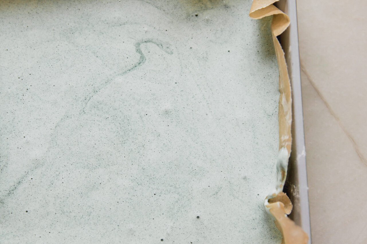 The green layer in the pan before solidifying. 