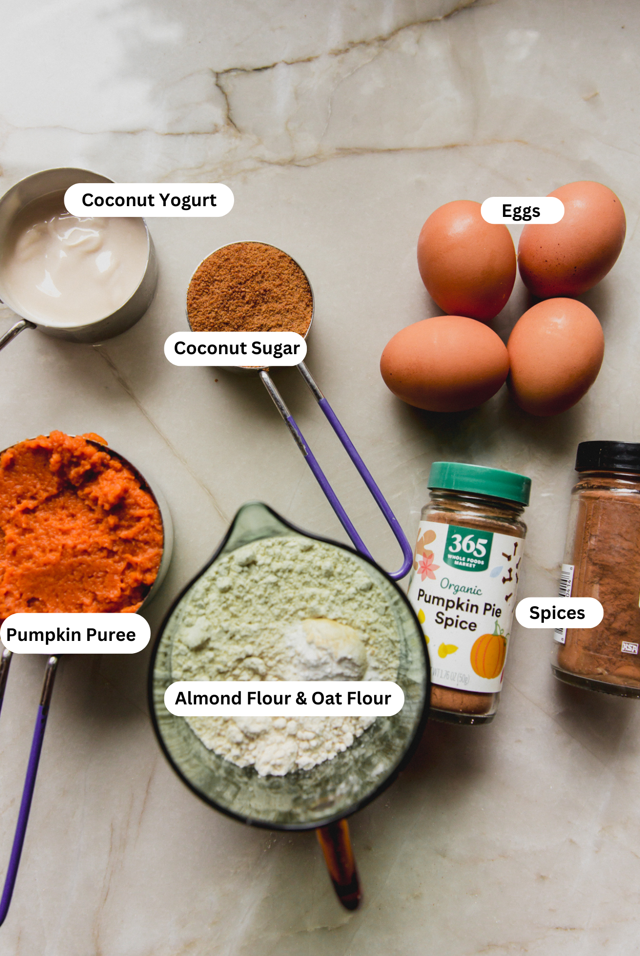 All the ingredients needed to make the almond flour pumpkin loaf set out before baking begins.