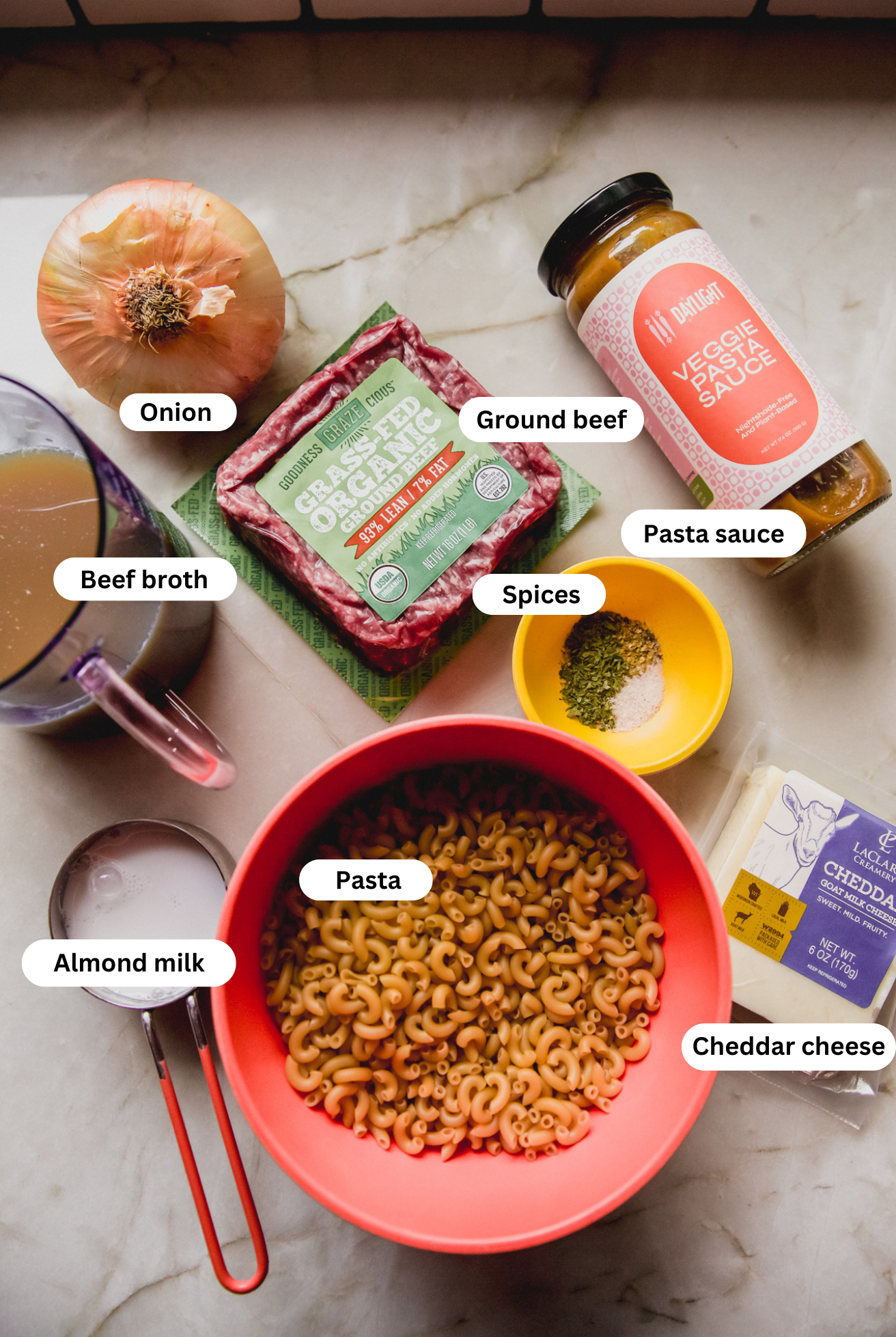 All the ingredients needed to make slow cooker hamburger helper before cooking.