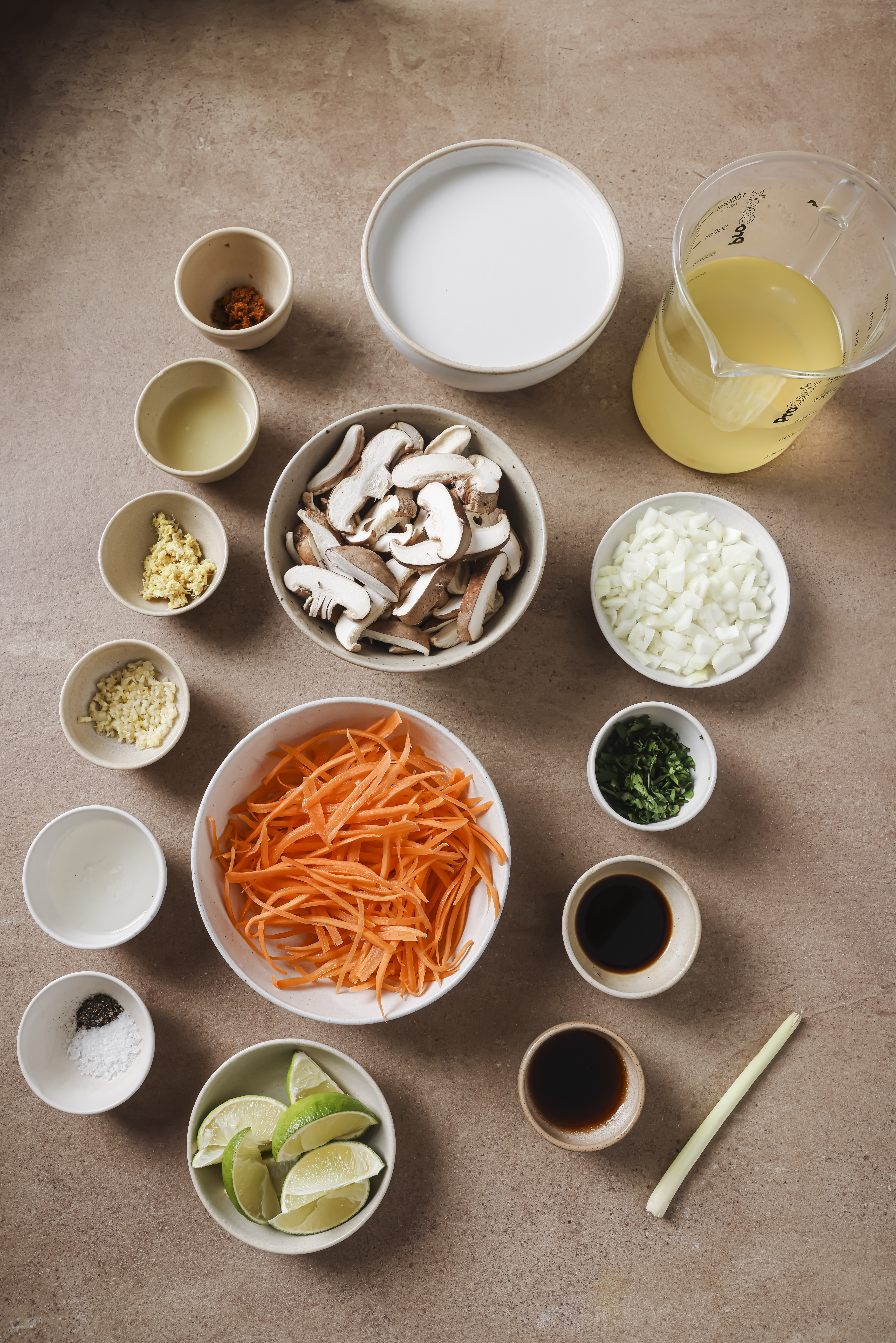 Tom kha soup ingredients in bowls.