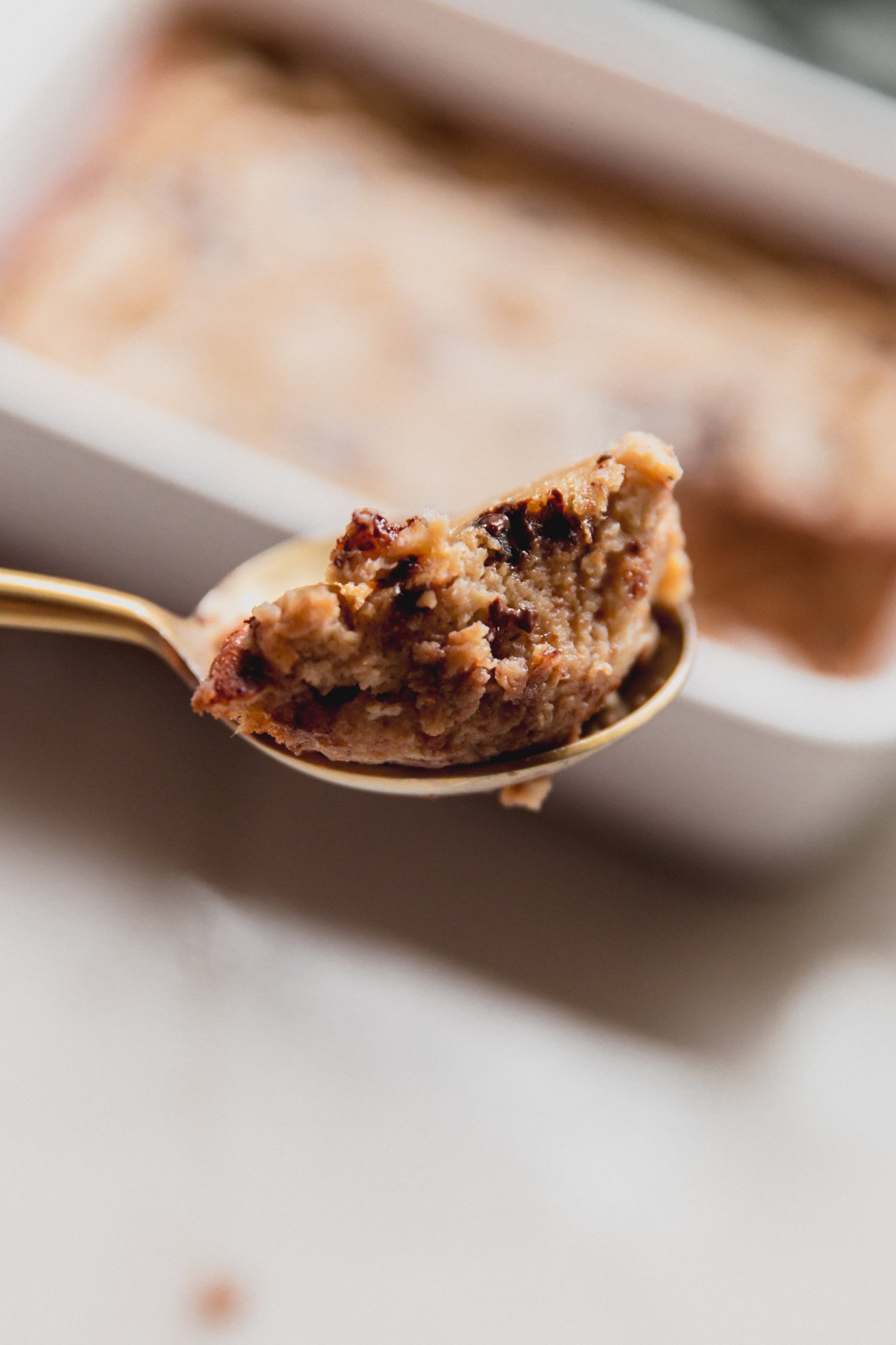 A spoonful of banana protein breakfast cake scooped out before being eaten.