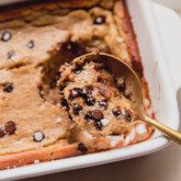 Banana protein breakfast cake being scooped with a spoon.