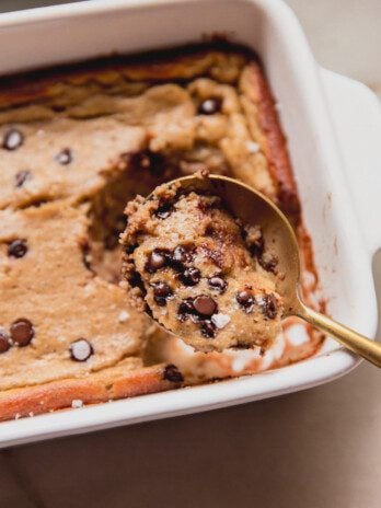 Banana protein breakfast cake being scooped with a spoon.