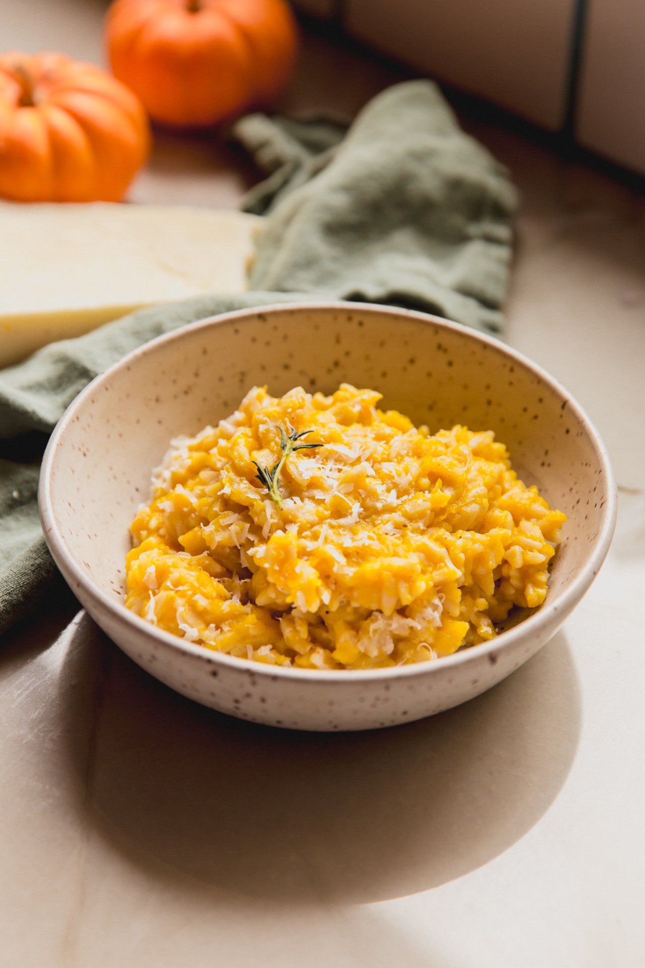 Pumpkin orzo topped with thyme and Pecorino. 