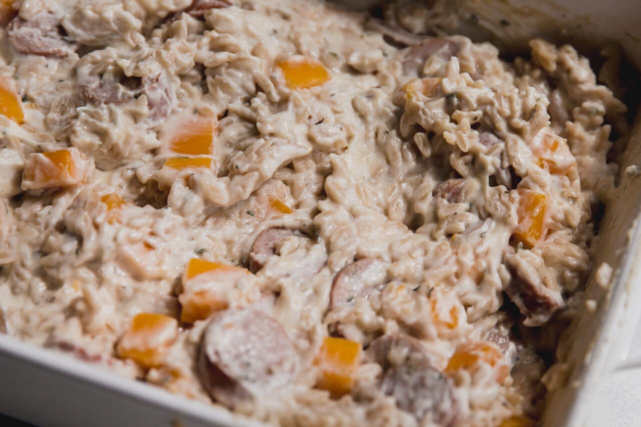 The finished one pan chicken sausage and orzo bake before being eaten.