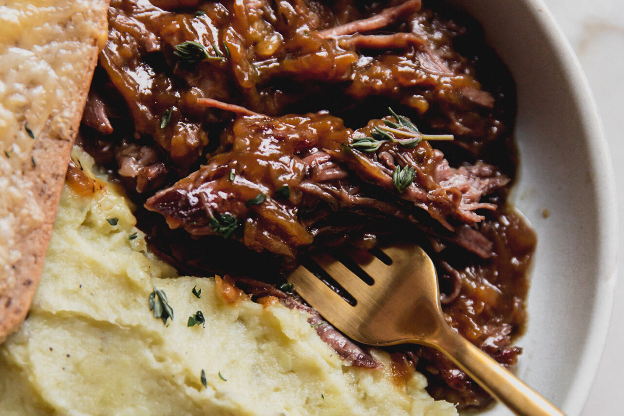French onion pot roast with a fork.