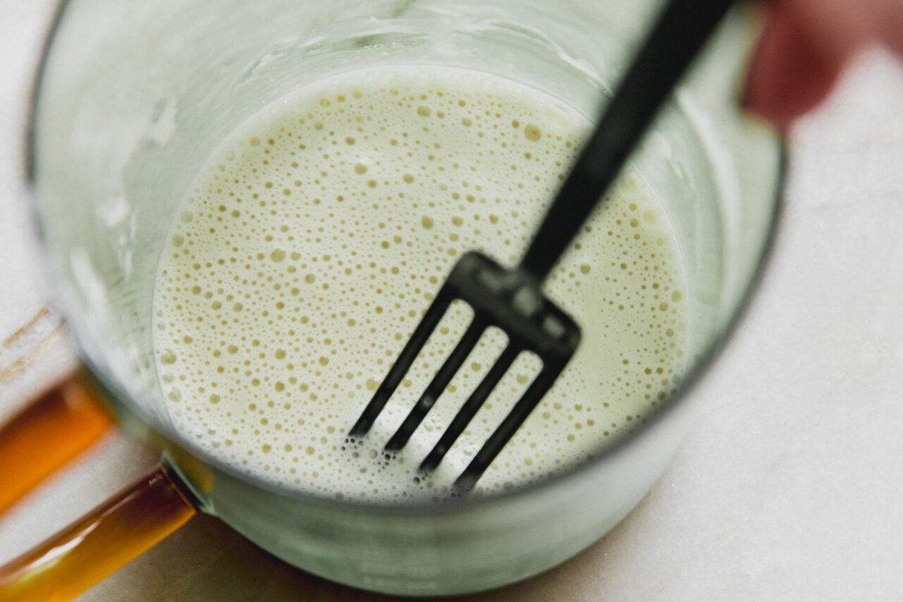 A fork mixing arrowroot starch and water.