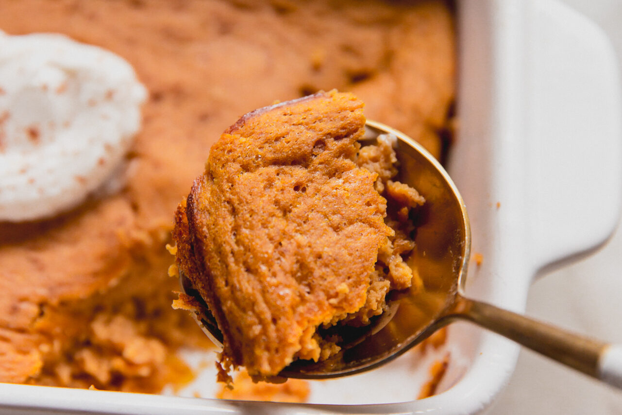 pumpkin protein cake with a spoon.