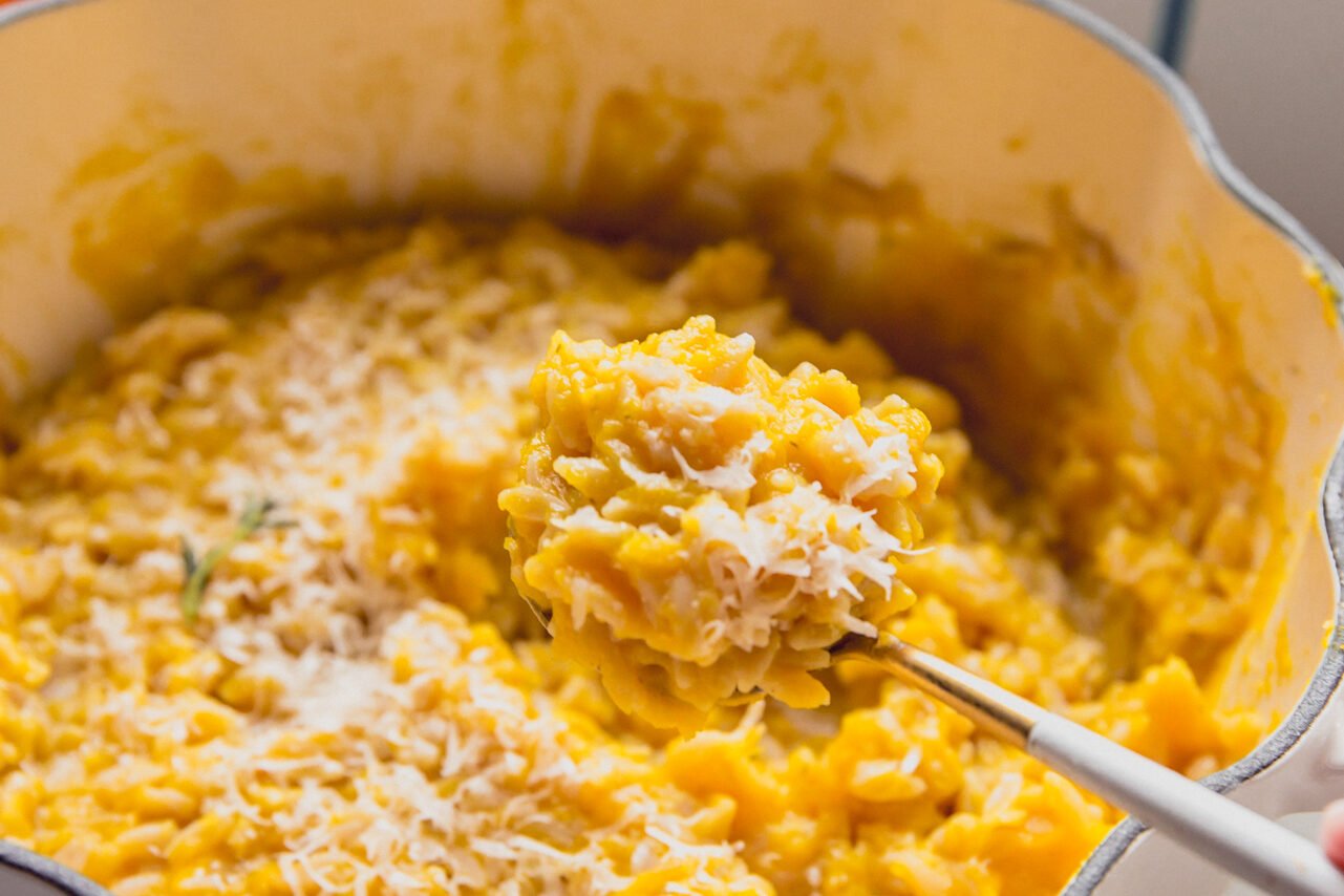 The finished pumpkin orzo topped with pecorino cheese before serving.