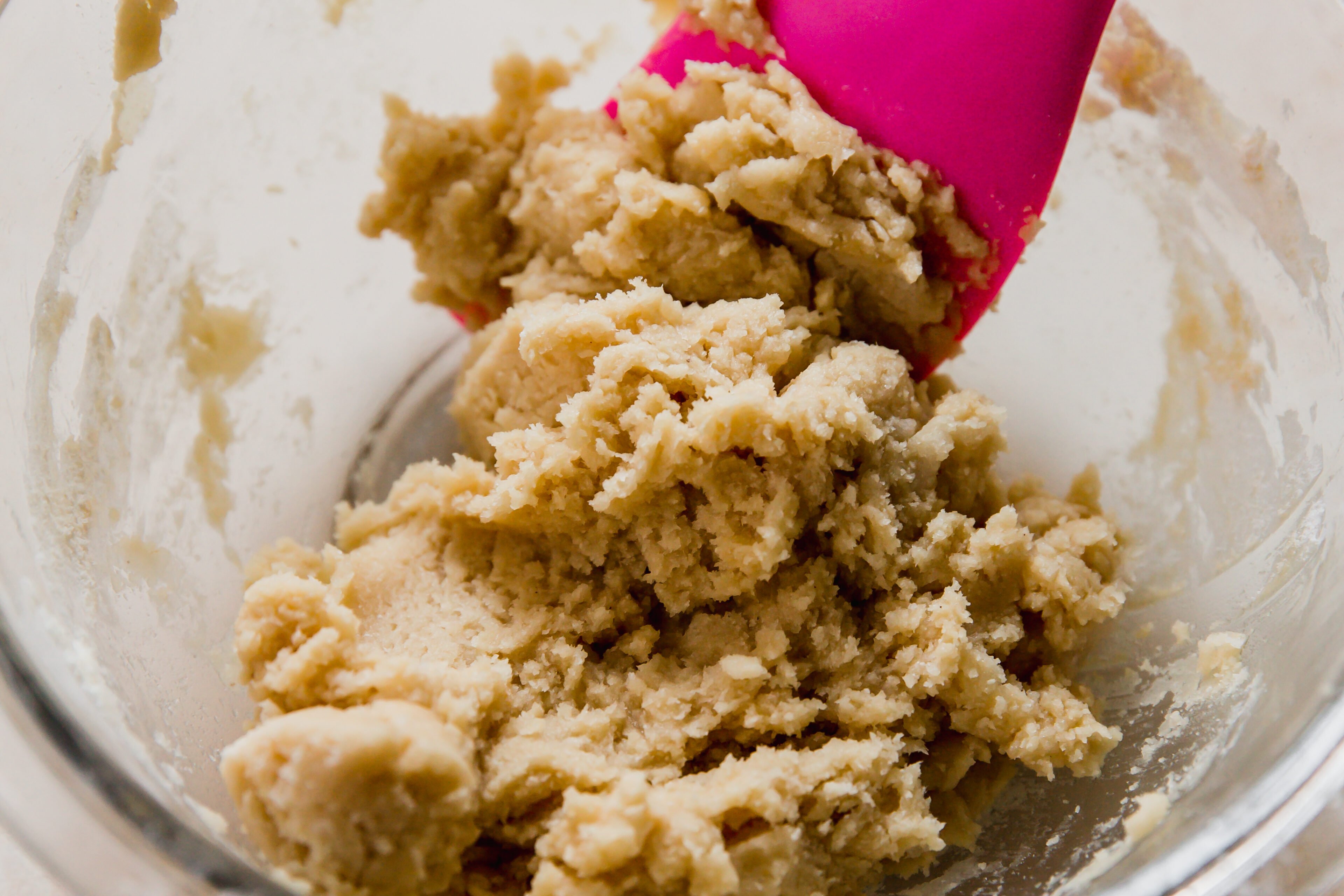 Shortbread crust ingredients being combined.