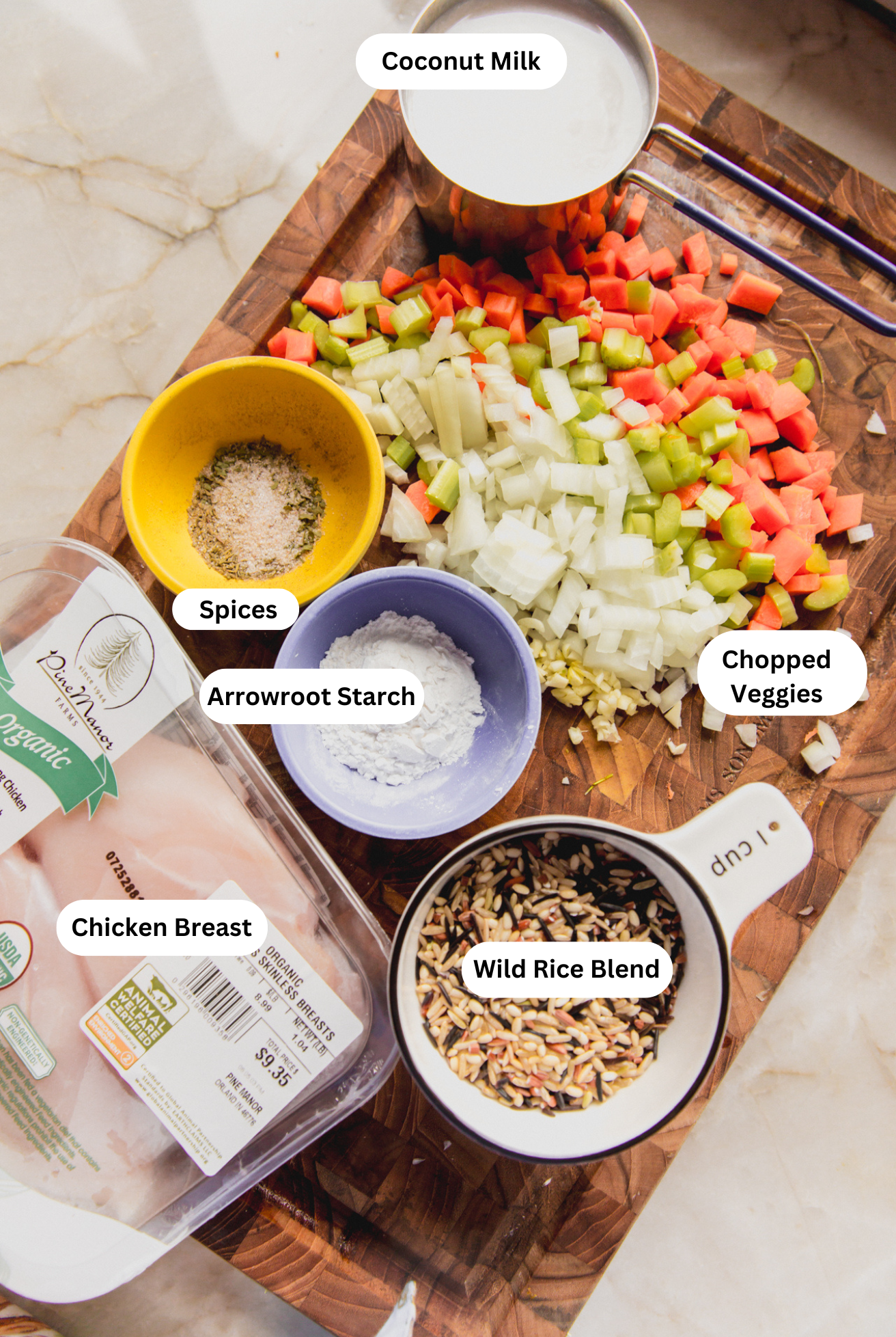 All of the ingredients needed to make creamy chicken and wild rice soup.