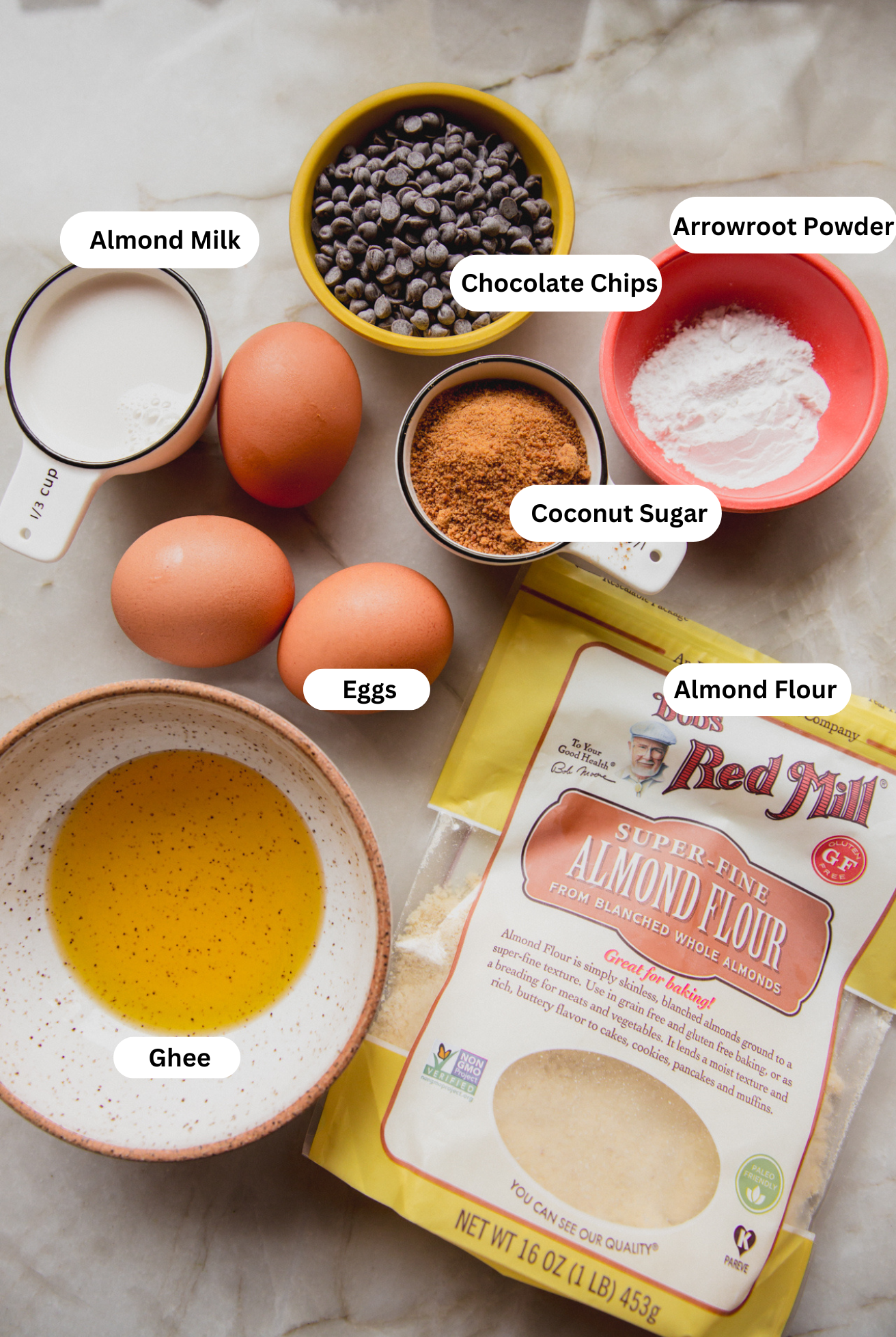 All the ingredients needed to make chocolate chip cookie pie out on a counter before cooking.